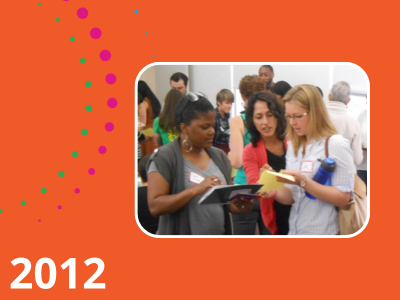 Graphic with orange background labeled 2021 with photograph of HRE USA members at an event