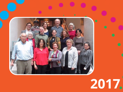 2017 text with graphic with a orange background and a photograph of the 2017 steering committee